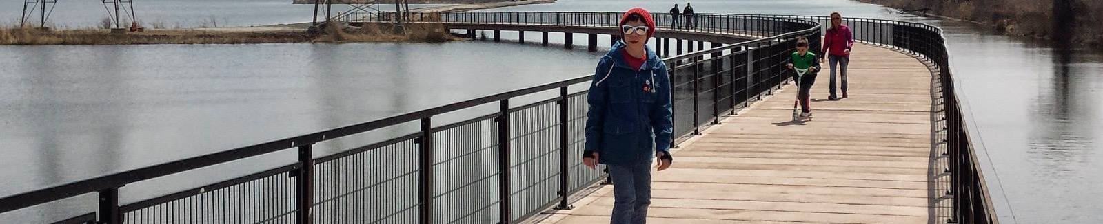 wolf_lake_boardwalk_skateboarder.jpg