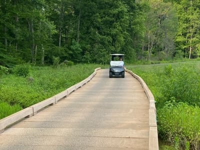 Eisenhower golf cart bridge crossing with cart 2