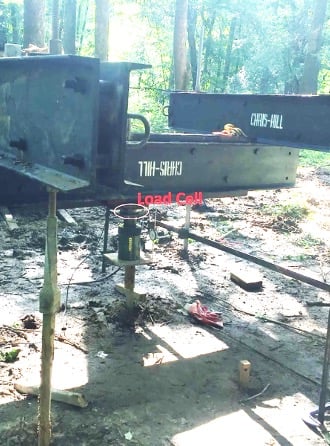 load cell on a helical pier boardwalk foundation